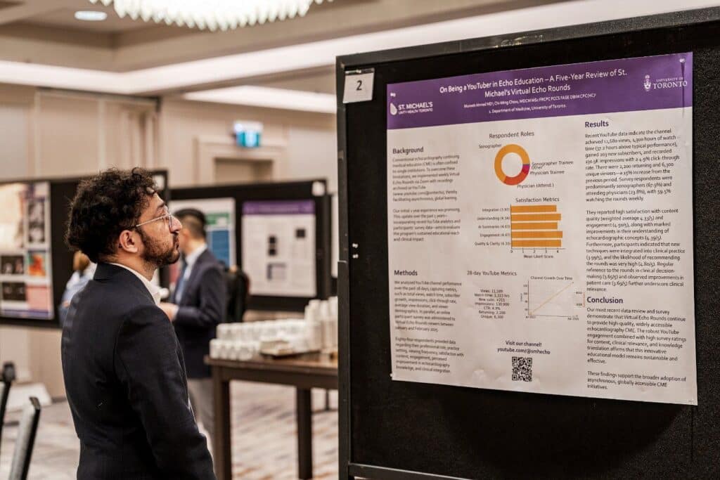 Person viewing academic research poster.